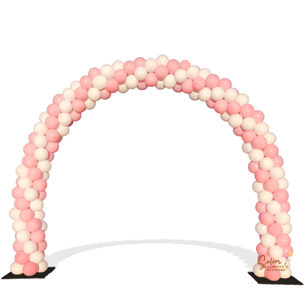 Traditional balloon arch in a pink and white swirl. Oregon Balloon decor.