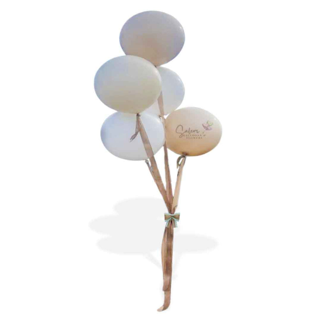 A cluster of 5 bubble gum looking balloons, in cream, white and beige, tied to  jute ribbons. Oregon Balloon Decor