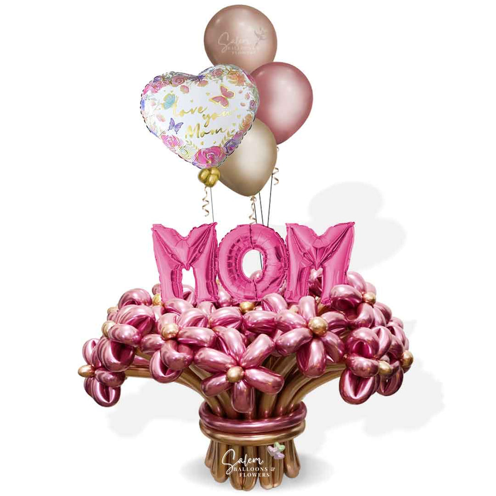 Mother's Day Flower balloon bouquet in various hues of pink and rose gold, with a MOM balloon sign and an I love you Mom message. Salem Oregon balloon delivery.