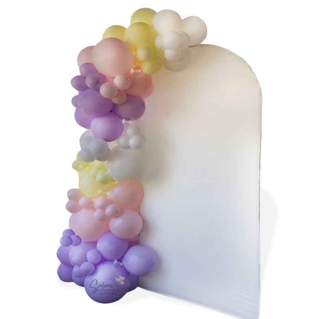 Pastel colors Balloon garland decorating an arch shaped backdrop. Oregon Balloon decor