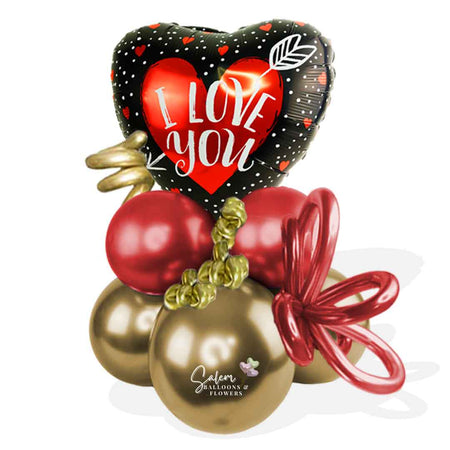 Balloon bouquet featuring a heart-shaped balloon with an " I love you" message. In red, gold, and black colors. Salem Oregon balloons.