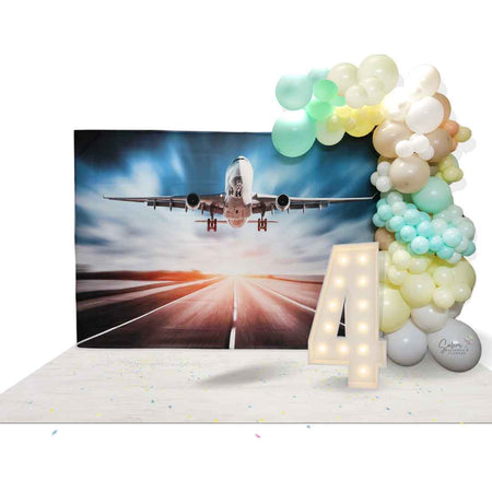 Balloon garland in pastel colors on a airplane backdrop. Salem Oregon balloon decor