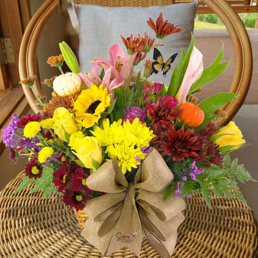 Fall themed flower arrangement in a brown basket. Flower delivery Salem Oregon. Size chart.