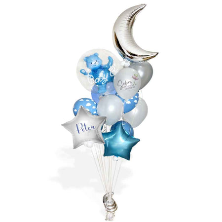 It's a Boy Balloon bouquet in silver, pastel blue and white. Featuring a stuffed bubble balloon with a blue teddy bear, a large moon and stars. Balloon delivery in Salem Oregon and nearby cities.