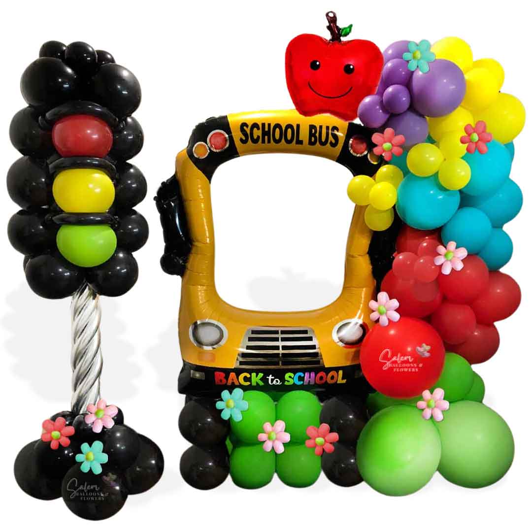 Back to school photo-booth balloon decoration. featuring a school bus, balloon garland and  a traffic light balloon column. Oregon Balloon Decor.