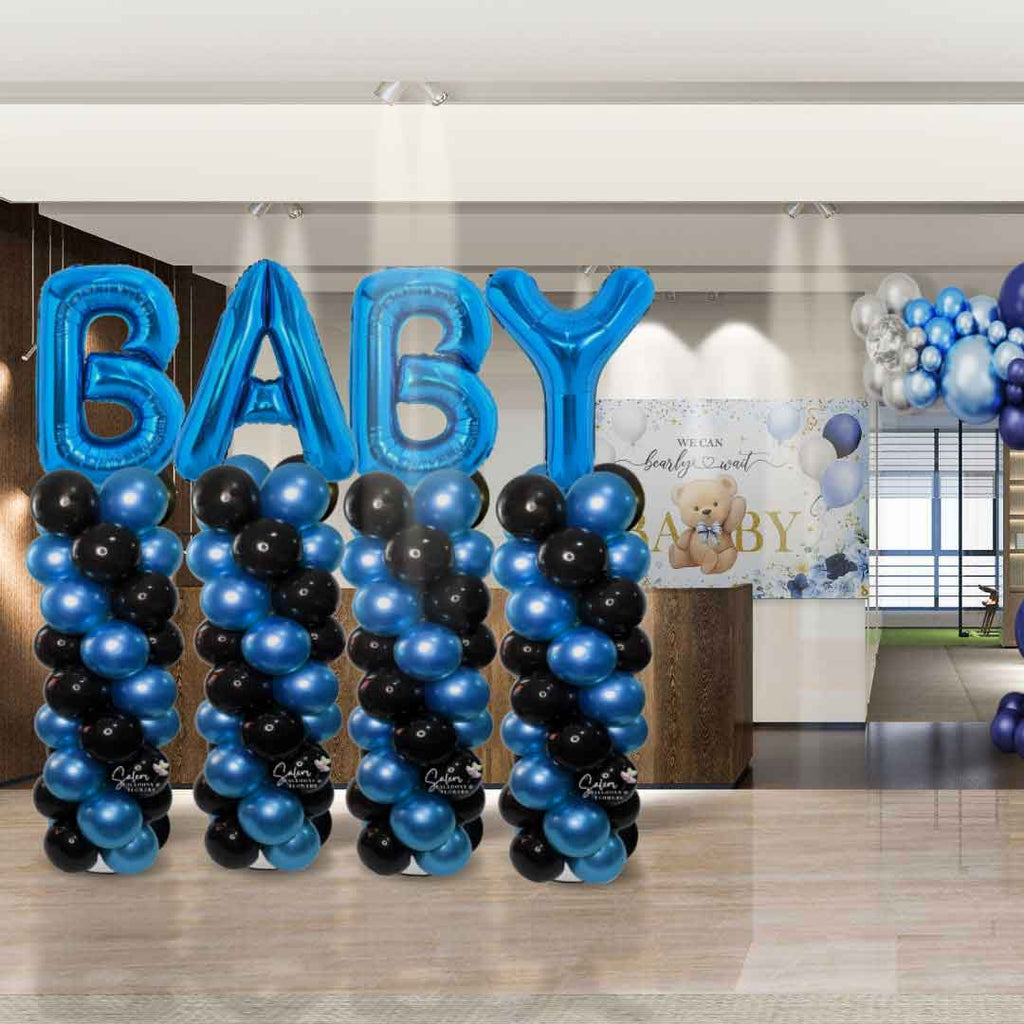 4 Balloon columns with letter balloon toppers spelling BABY decorating lobby for a baby shower. Oregon balloon decor.