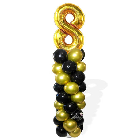 Balloon column with number balloon topper in gold and black. Oregon Balloon Decor.