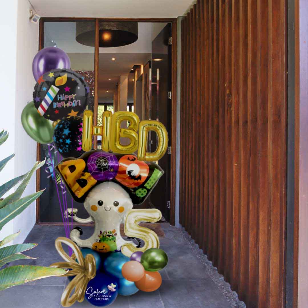 A Halloween-themed birthday bouquet featuring a large ghost balloon carrying an 