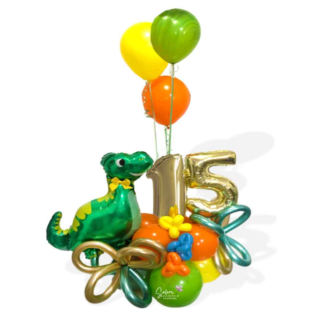 Dinosaur themed number balloon bouquet with a cute dinosaur balloon, in a kiwi green, orange and yellow color palette. Salem Oregon balloon delivery.