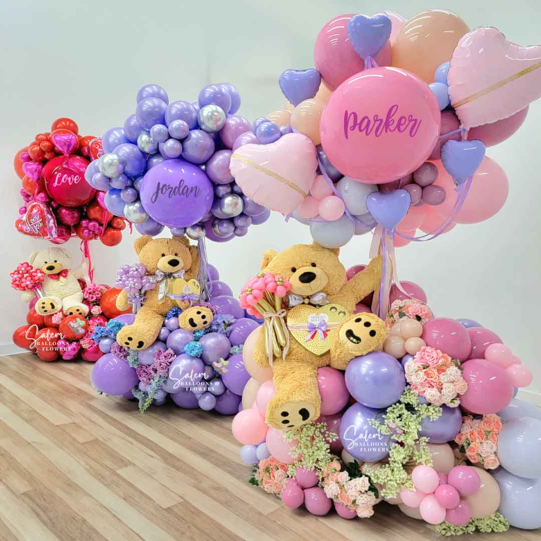 3 gigantic Balloon arrangements with large teddy bear plush. One in pink, one in purple, and one in red. Salem Oregon balloon Decorations