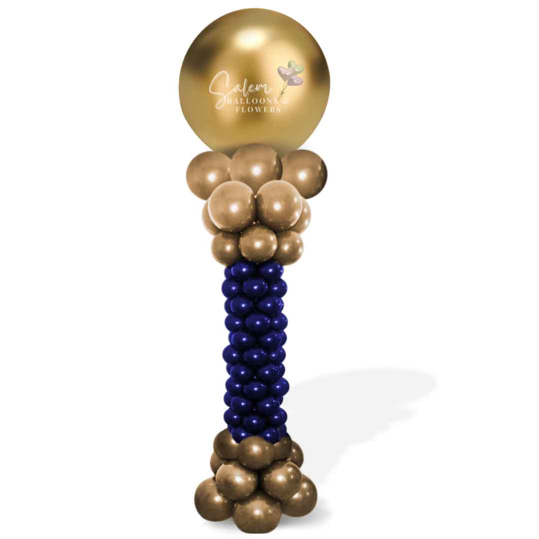 A balloon column with a curvy form and round topper in gold and blue. Oregon Balloon Decor