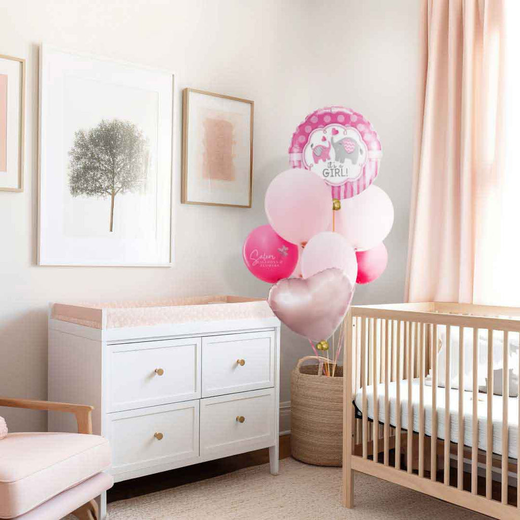 A baby girl nursery room decorated with a 