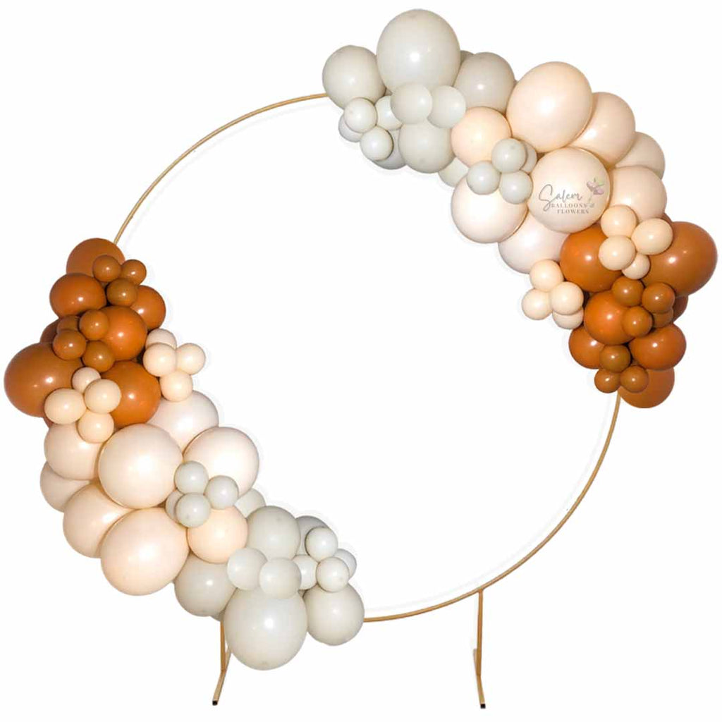 Two organic balloon garlands on a gold hoop. Salem Oregon Balloon decor.