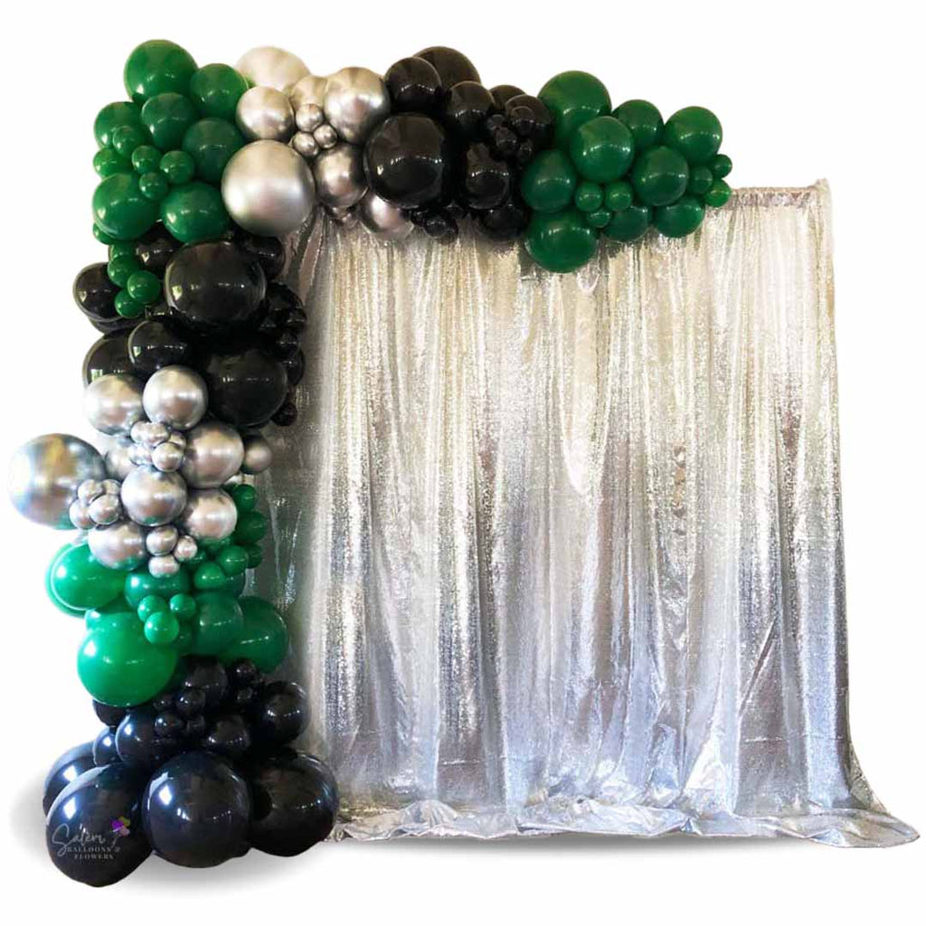 organic Balloon garland on a frame with silver backdrop. Salem Oregon balloon decor.