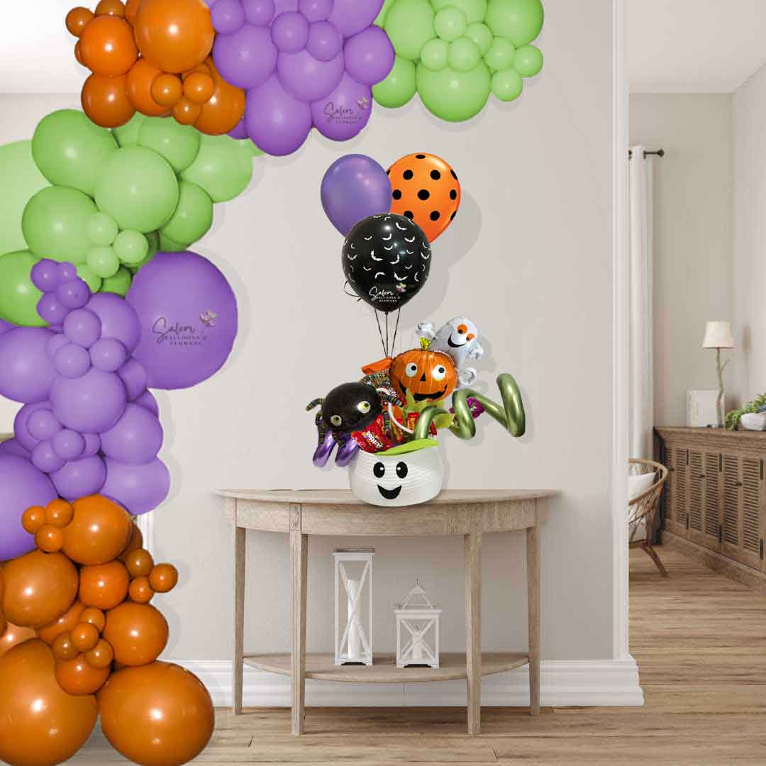 Ghost head basket filled with candy, halloween balloons and a set of helium balloons. Balloon delivery Salem Oregon and nearby cities. On site size chart