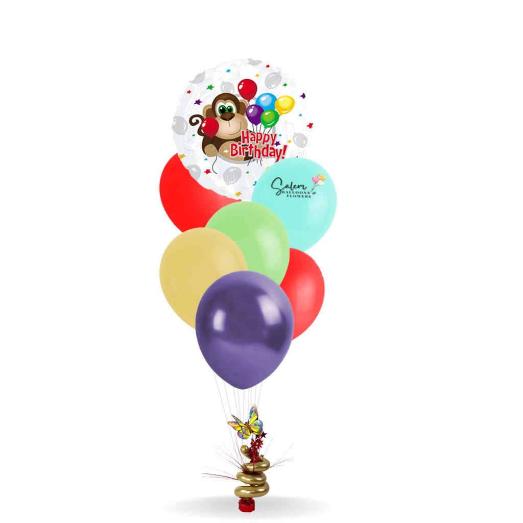 Moneky themed helium balloon bouquet. Birthday balloons featuring a monkey. Salem Oregon balloon delivery.