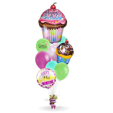 Mega Size Happy Birthday Balloon Bouquet. Featuring an extra large cupcake balloon with a "Happy Birthday" message and a an assortment of complementary colors helium balloons anchored to a decorated weight. Free delivery in Salem Oregon and nearby areas.