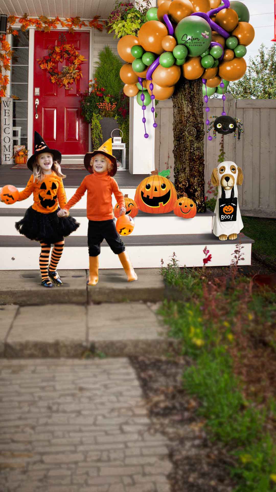 2 kids with halloween costumes standing in front of a porch decorated with a Halloween-themed balloon decoration, featuring a balloon tree with a cute spider, pumpkins, a treater doggy. Oregon Balloon Decor.