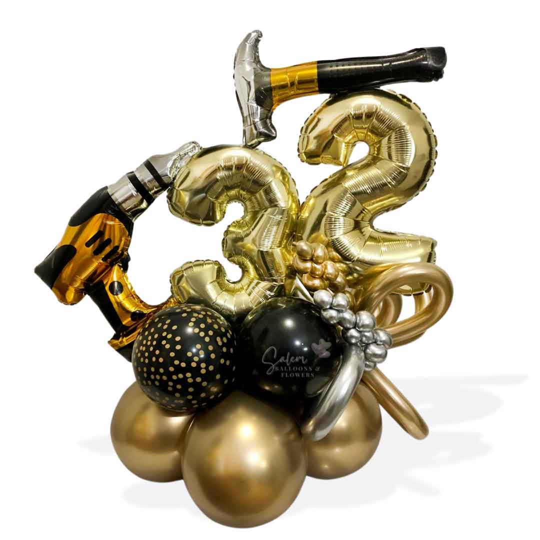 Number Balloon Arrangement, featuring a balloon hammer and a drill, decorated with curly balloons in gold, black and some touches of silver. Oregon Balloon Delivery