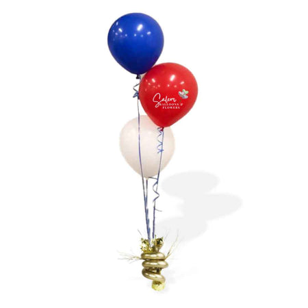 Balloon Centerpiece made of 3 helium balloons anchored to a decorated weight. Oregon Balloon Decor.