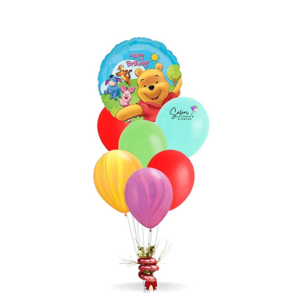 Winnie the Pooh themed birthday helium balloon bouquet. Salem Oregon balloon delivery.