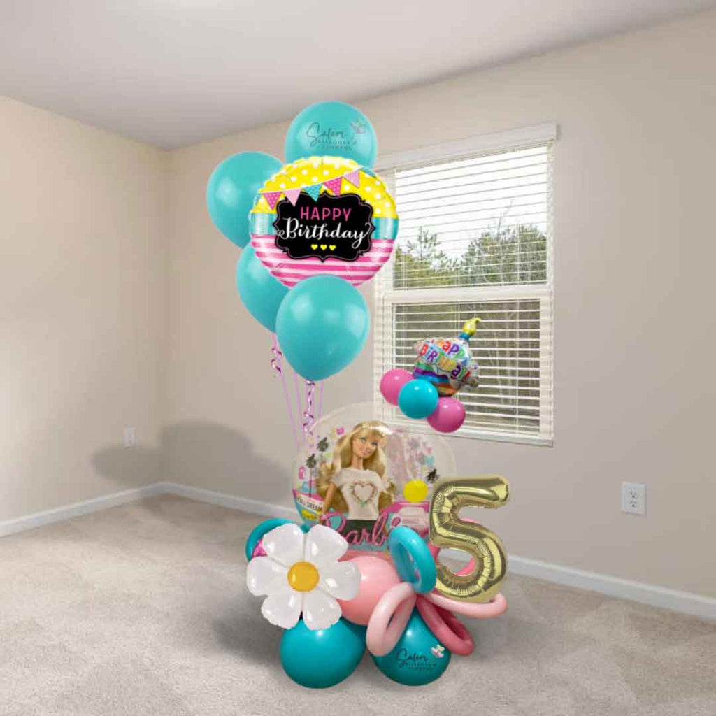 Barbie-themed Balloon Arrangement standing in the corner of a room in a Barbie color palette decorated with curly balloons. Oregon balloon Delivery. Birthday Balloons