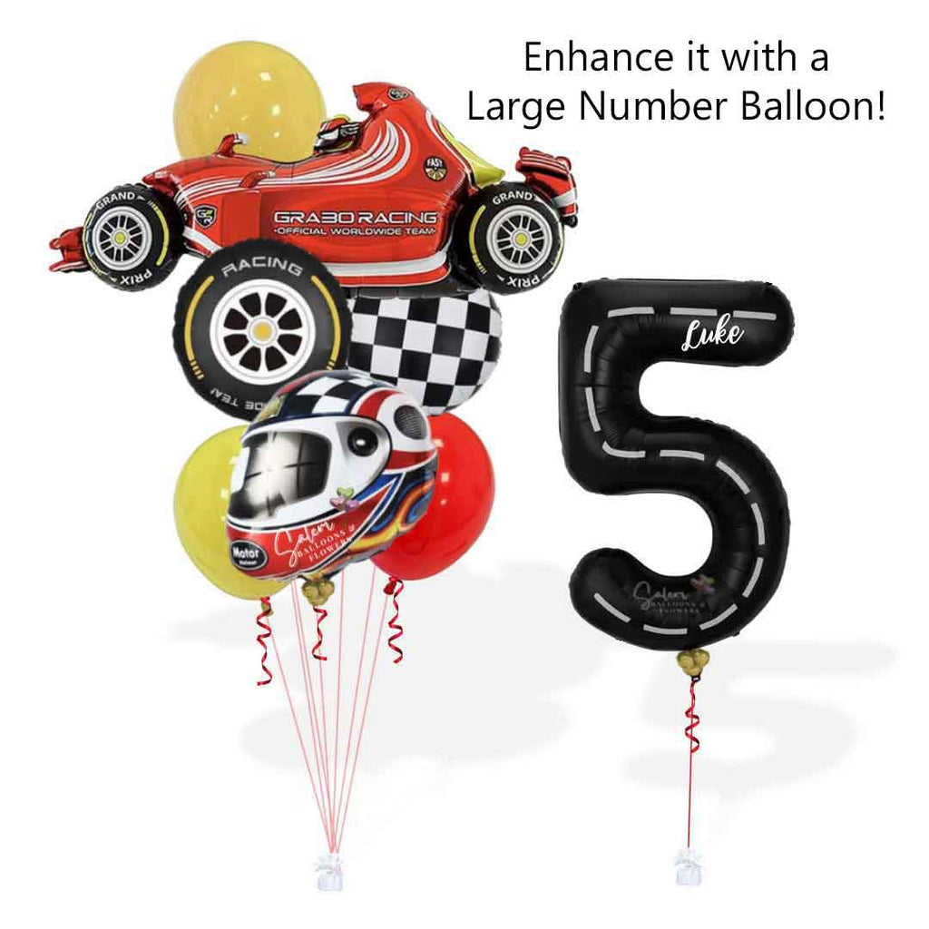 A tall helium Balloon bouquet, featuring a red sports car shaped balloon, a helmet shaped balloon, a race car wheel balloon and Latex balloons in Red, black, yellow and touches of blue next to a black number balloon 5 with a race track design. Oregon balloon delivery.