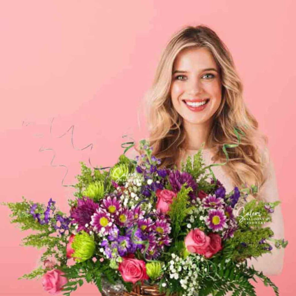 A young girl holding a laash flower arrangement in a basket. Salem Oregon flower delivery.