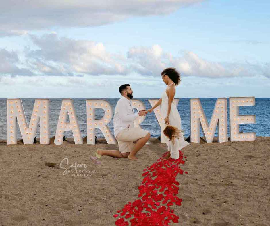 Proposal on the beach with light up marquee letters spelling Marry Me. Oregon Marquee Letters for rent. Salem Oregon