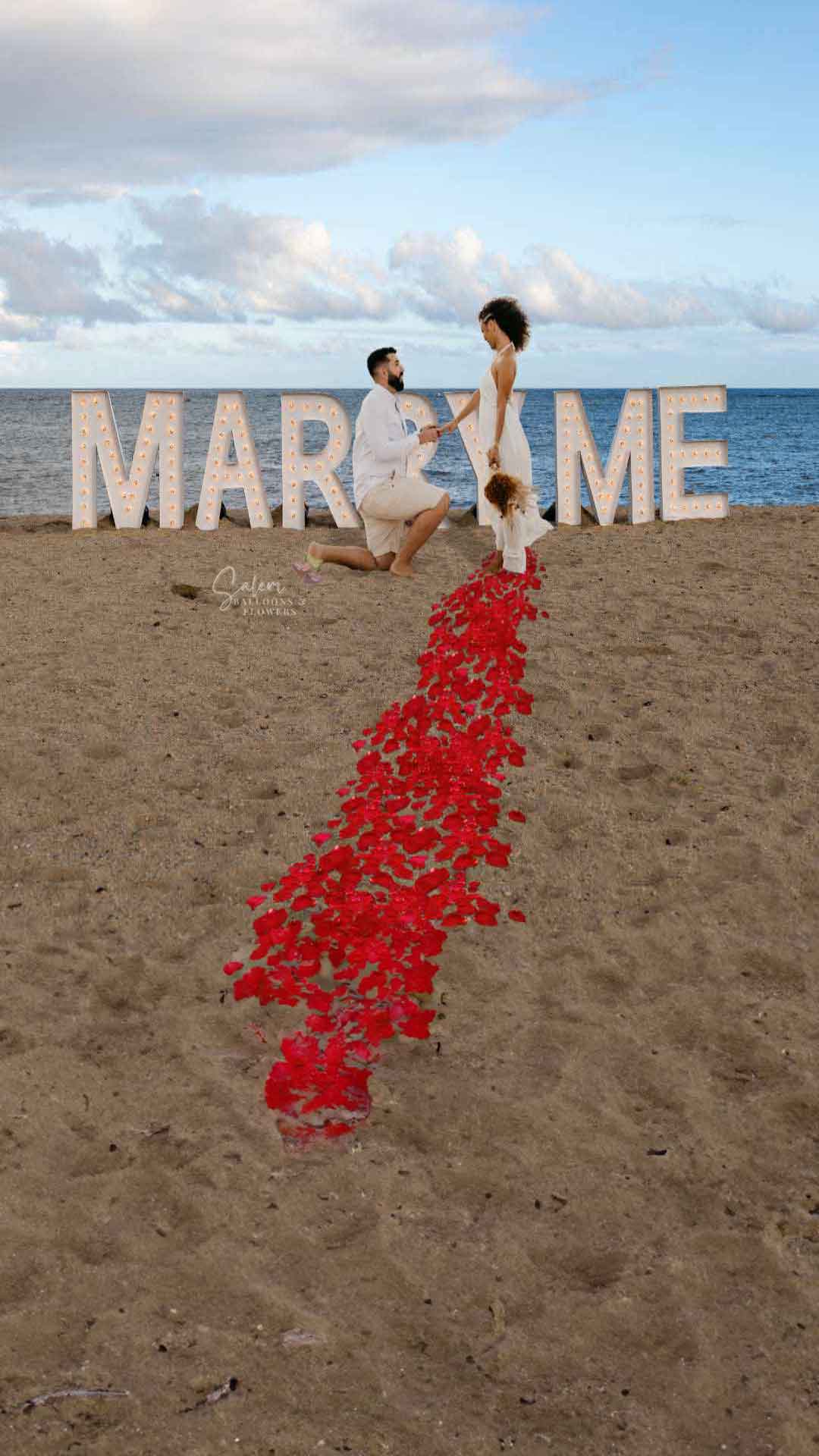 Proposal on the beach with light up marquee letters spelling Marry Me. Oregon Marquee Letters for rent. Salem Oregon