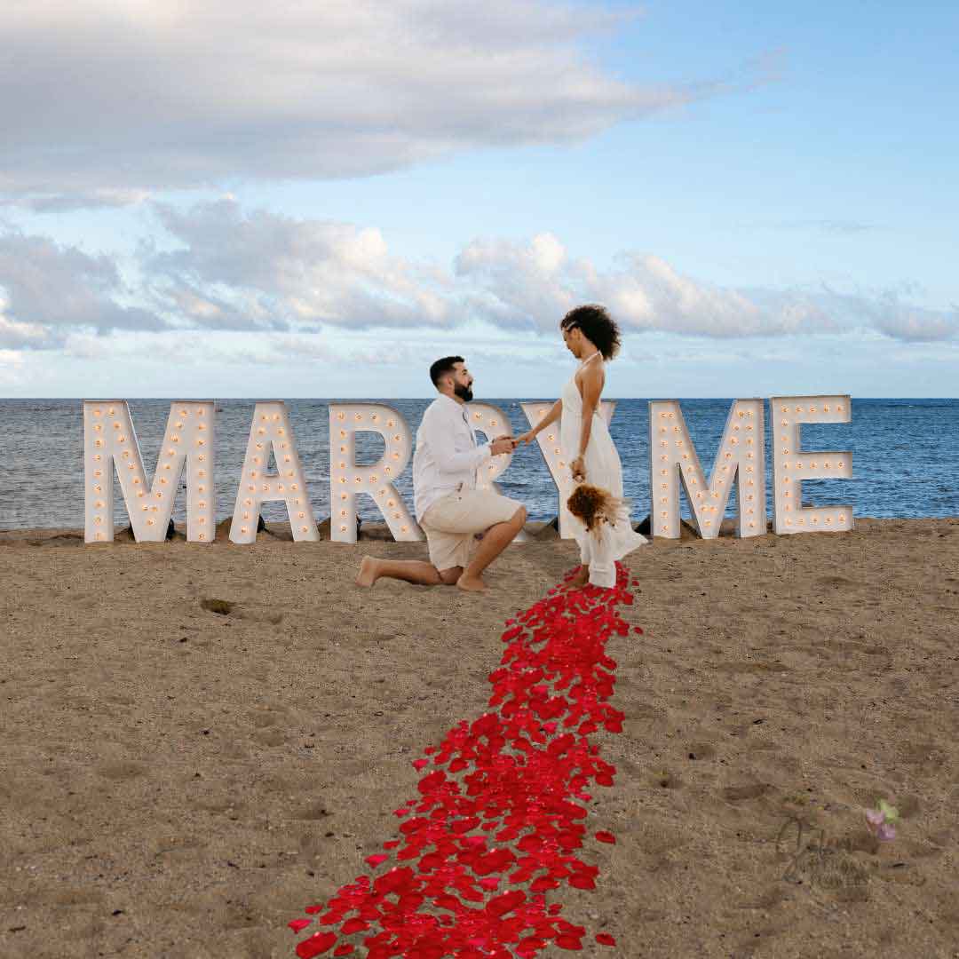 Marriage proposal on the beach with light up marquee letters spelling Marry Me. Oregon Marquee letters rentals.