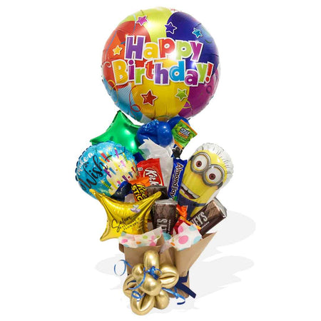 Minion-themed candy-balloon box. With a Mini Minion Mylar balloon holding a "Happy Birthday" balloon, in a box filled with candy, chocolates and balloons. Balloon delivery in Salem Oregon and nearby cities.