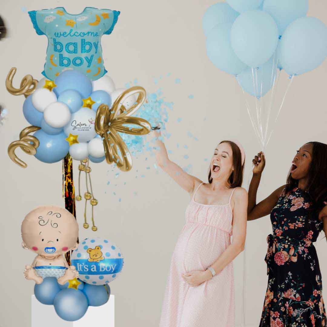 A lady throwing blue confetti next to a Welcome baby boy balloon column, in pastel blue and white, and decorated with golden stars and curly balloons. Oregon Balloon Decor.