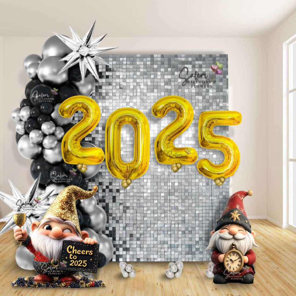 New Year's 2025 balloon decoration featuring a stunning silver shimmery wall adorned with a silver and black balloon garland, accented by shiny pointy silver stars and two adorable gnome cutouts. The centerpiece is '2025' balloon numbers floating in front of the dazzling backdrop. Perfect for celebrating the new year in style. Balloon Decor available in Oregon.