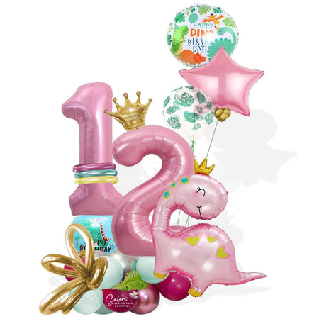 Pink dinosaur themed number balloon marquee. Featuring a large pink dinosaur wearing a golden crown, decorated with helium balloons. Balloons salem oregon. Balloon delivery