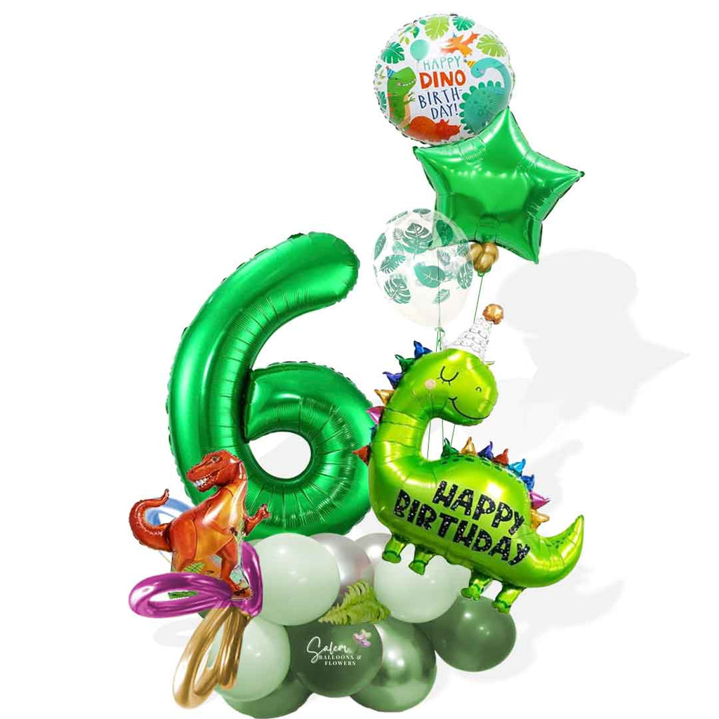 A name and a Dinosaur-themed number balloon marquee. Featuring Dinosaur shaped balloons, 1 large number balloon and a helium balloon bouquet, standing in front of a door. Approx 7 ft Tall. Salem Oregon balloon decor. Balloons Salem Oregon