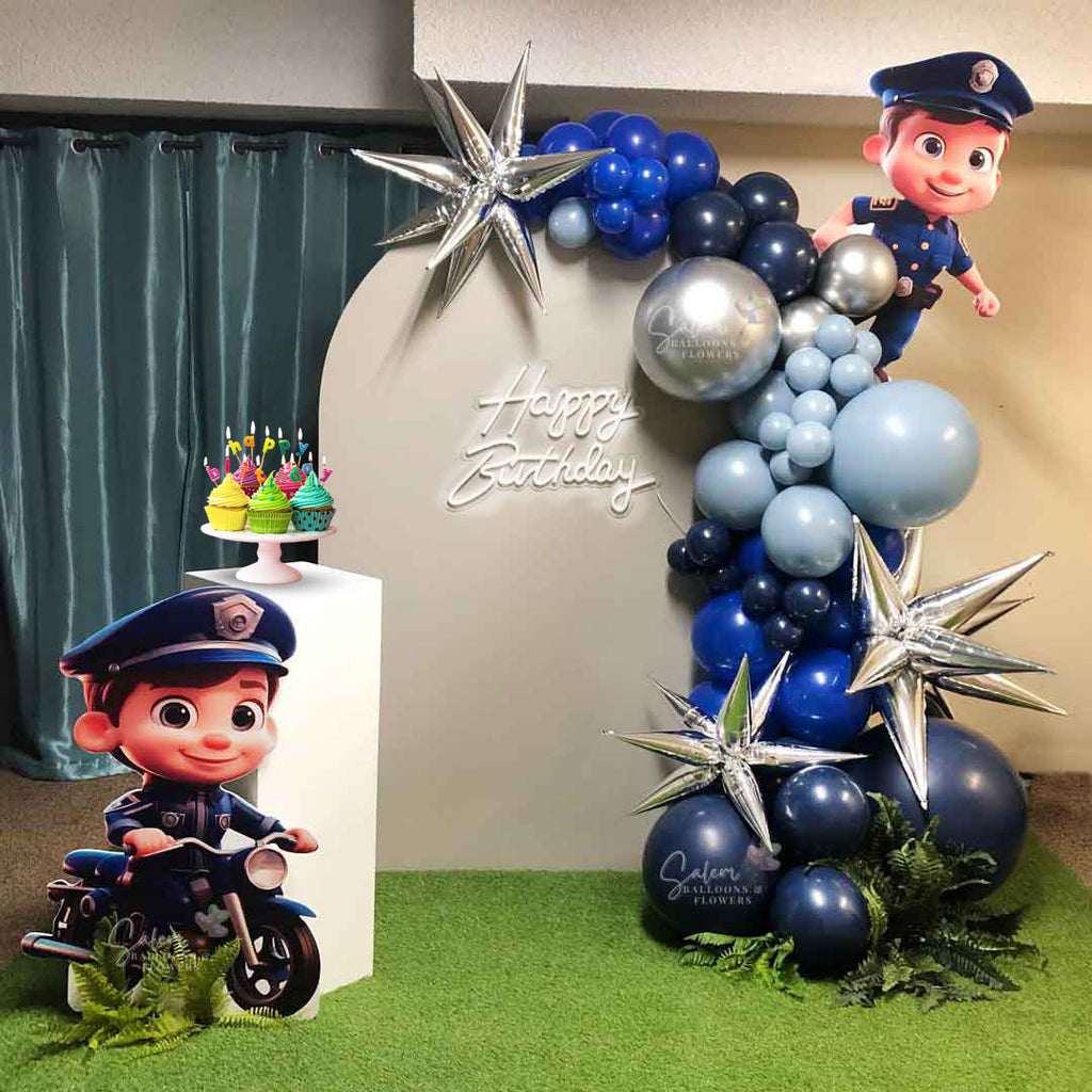 Police themed balloon decor in blue and silver colors. Balloon garland, Happy Birthday neon sign, and 2 cop cutout signs. Oregon Balloon decor.