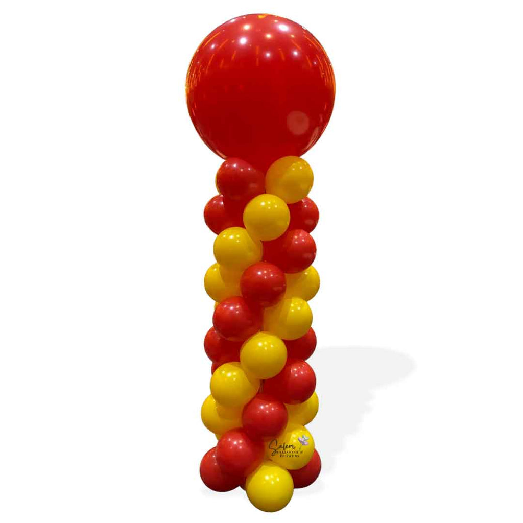 balloon column in red and yellow with a red round topper. Oregon balloon decor.