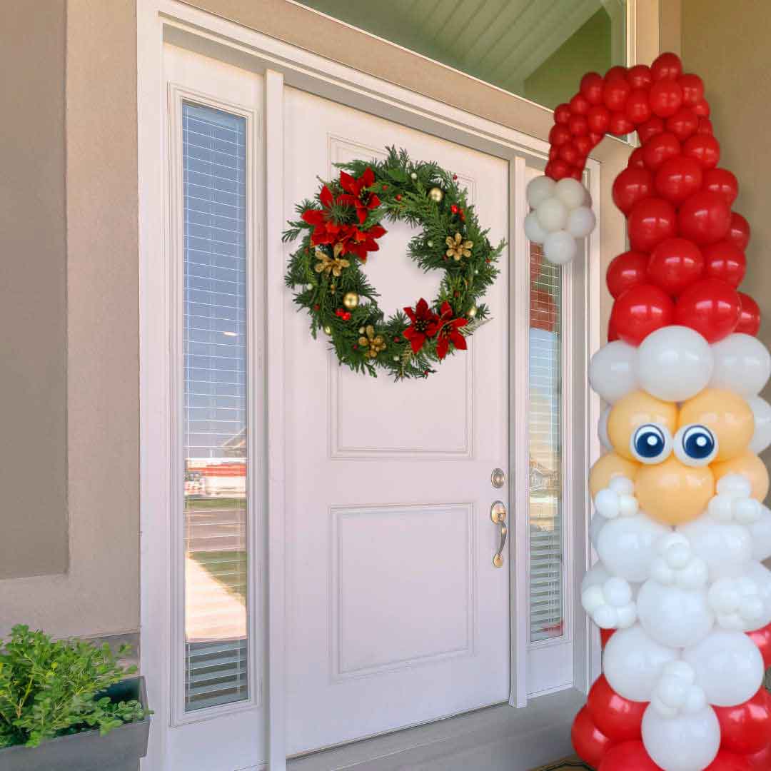 A Tall Santa Claus shaped balloon column standing in front of a door entry in red and white. Oregon Balloon Decorations