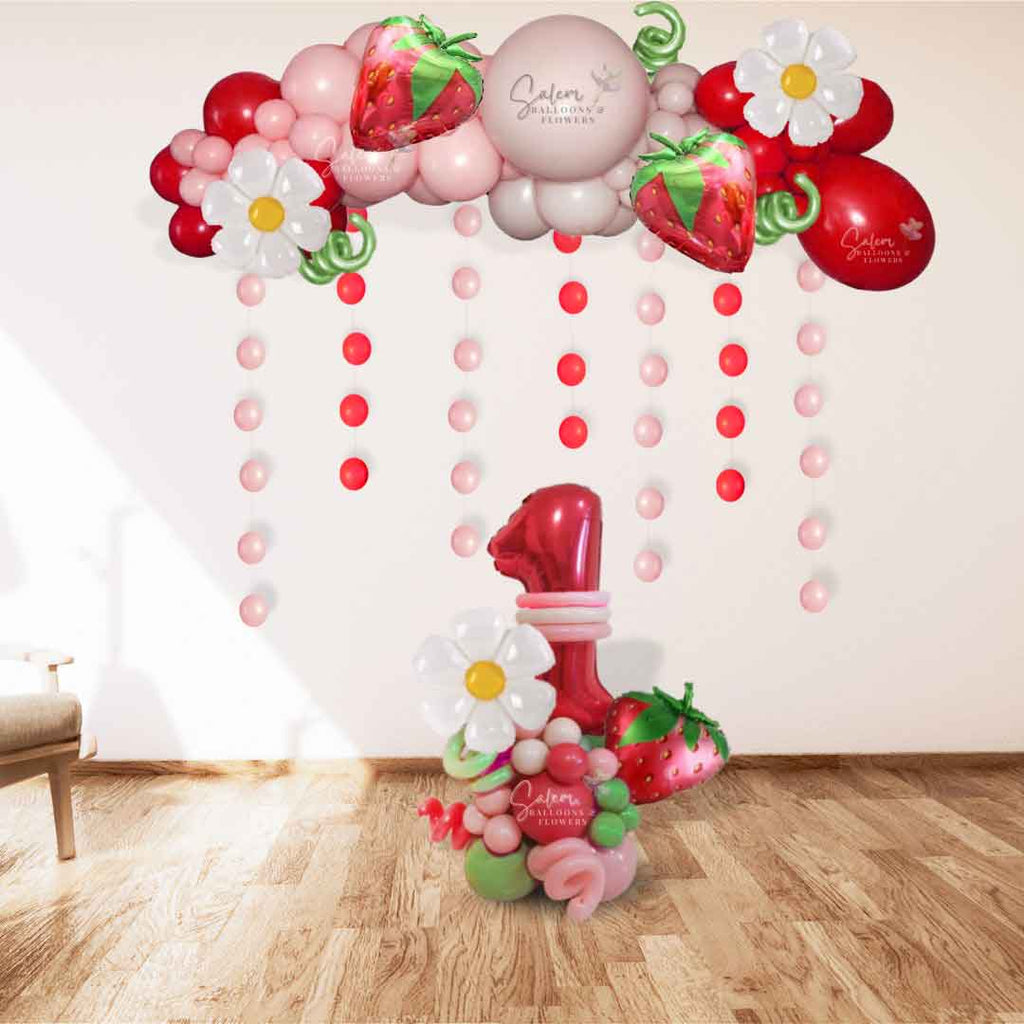 Strawberry Shortcake themed balloon decoration, featuring a balloon garland, number balloon bouquet, out in shades of in pinks, red and a touch of green. Balloon Decor. Oregon.