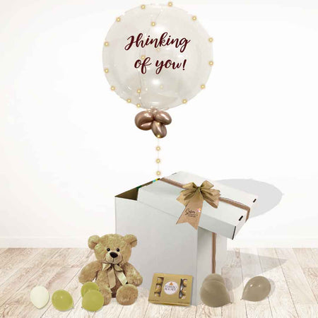 Thinking of you balloon box. Filled with a light-up bubble balloon with a "Thinking of You" message, a soft plush and chocolates. Delivery in Salem Oregon and nearby cities.