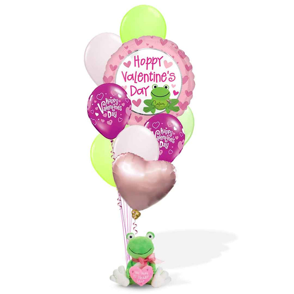 A sweet frog plush delicately holds a charming balloon bouquet and a heart that expresses your love with an embroidered 