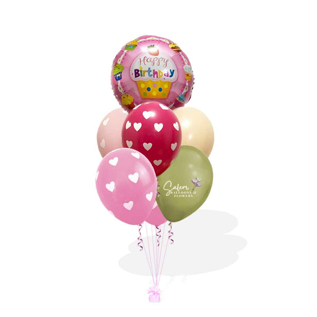 A cupcake themed helium filled balloon bouquet in pink and green colors. Birthday balloon delivery Salem Oregon and nearby cities.