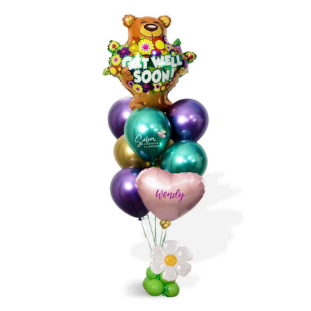 Get Well helium balloon bouquet. Featuring a large teddy bear balloon holding flowers with a "Get Well" message in vibrant colors. Oregon Balloon delivery.