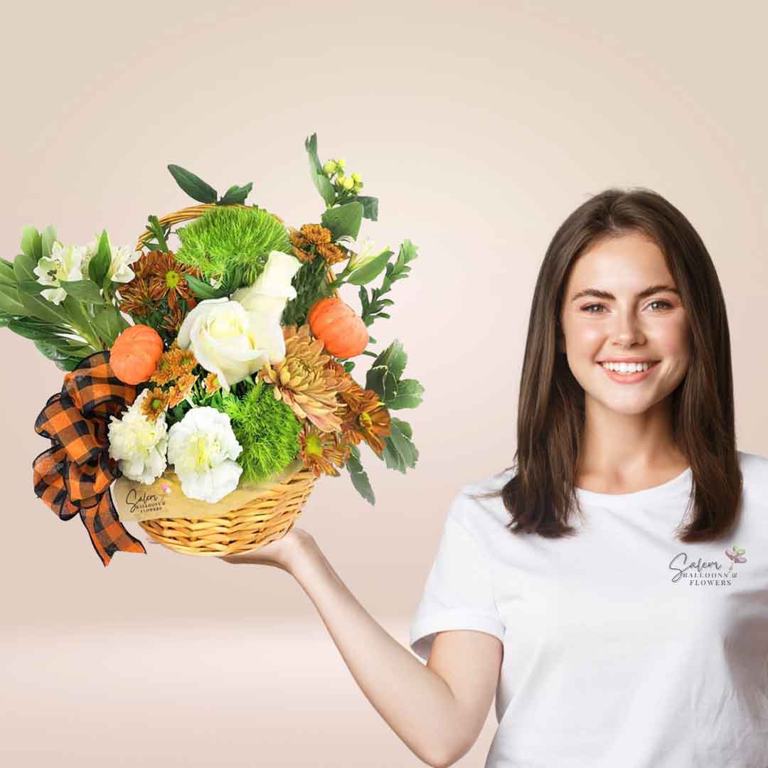 a young girl holding a Fall themed flower arrangement in a basket. Salem Oregon flower delivery