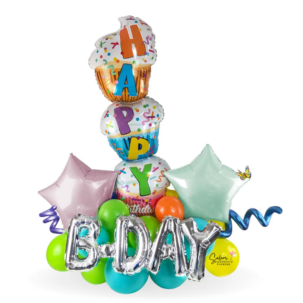 Large and colorful birthday balloon bouquet. Featuring a triple cupcake balloon with a Happy Birthday message. Deluxe style comes with a set of helium balloons featuring a candy balloon. Premium style includes a box of chocolates.  Free delivery in Salem Oregon and nearby areas.