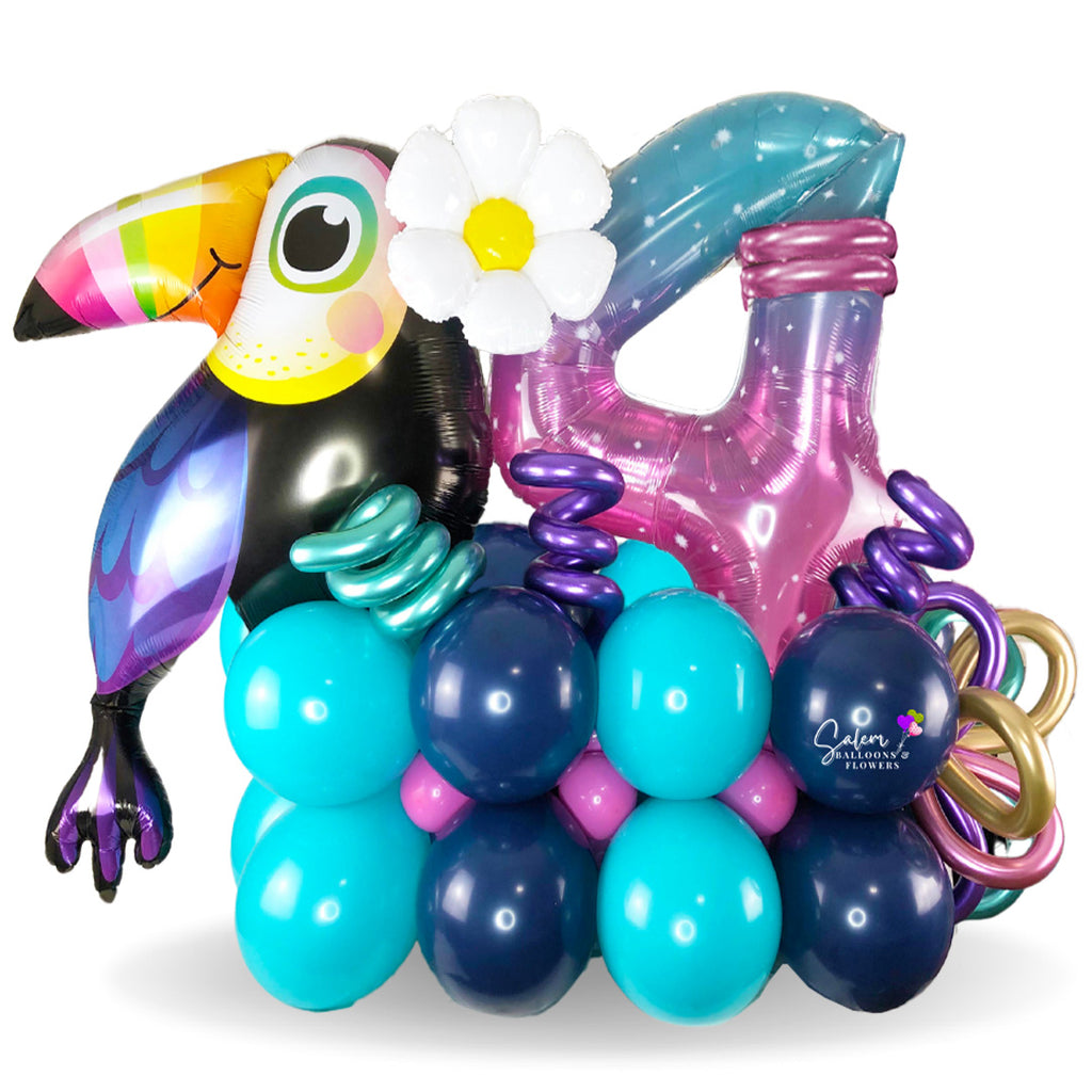 Happy Birthday balloon bouquet. Featuring an extra large gorgeous toucan balloon with balloon numbers in a very tropical style. Balloon delivery in Salem Oregon. Keizer Oregon.